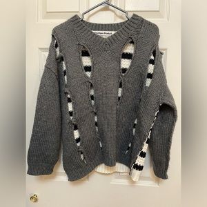The Open Product Cutout Sweater